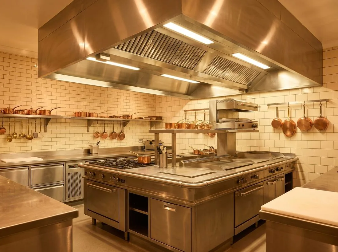 A commercial kitchen build — services, stainless and extraction, to code